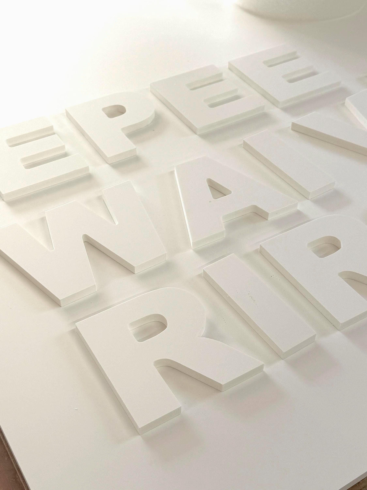 Custom white PVC letters, 1/2 inch thick, made by Prince Fabrication