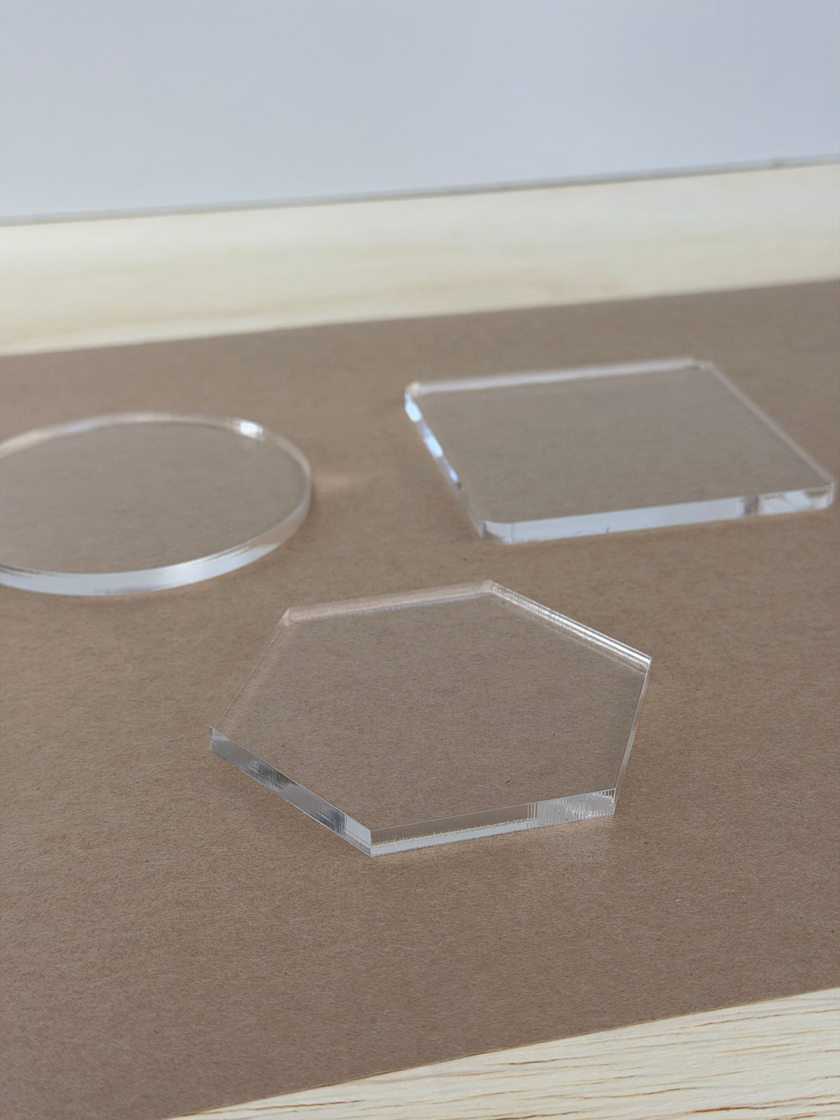 1/4 inch thickness of clear acrylic coaster blanks shown at an angle
