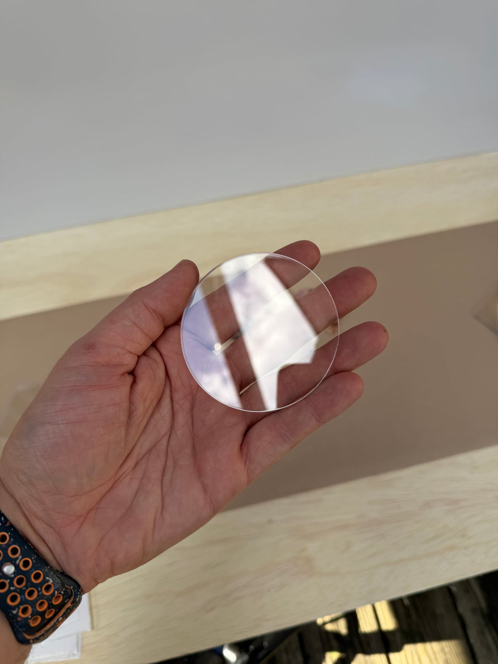 6 inch clear acrylic circle plaque blank held in hand