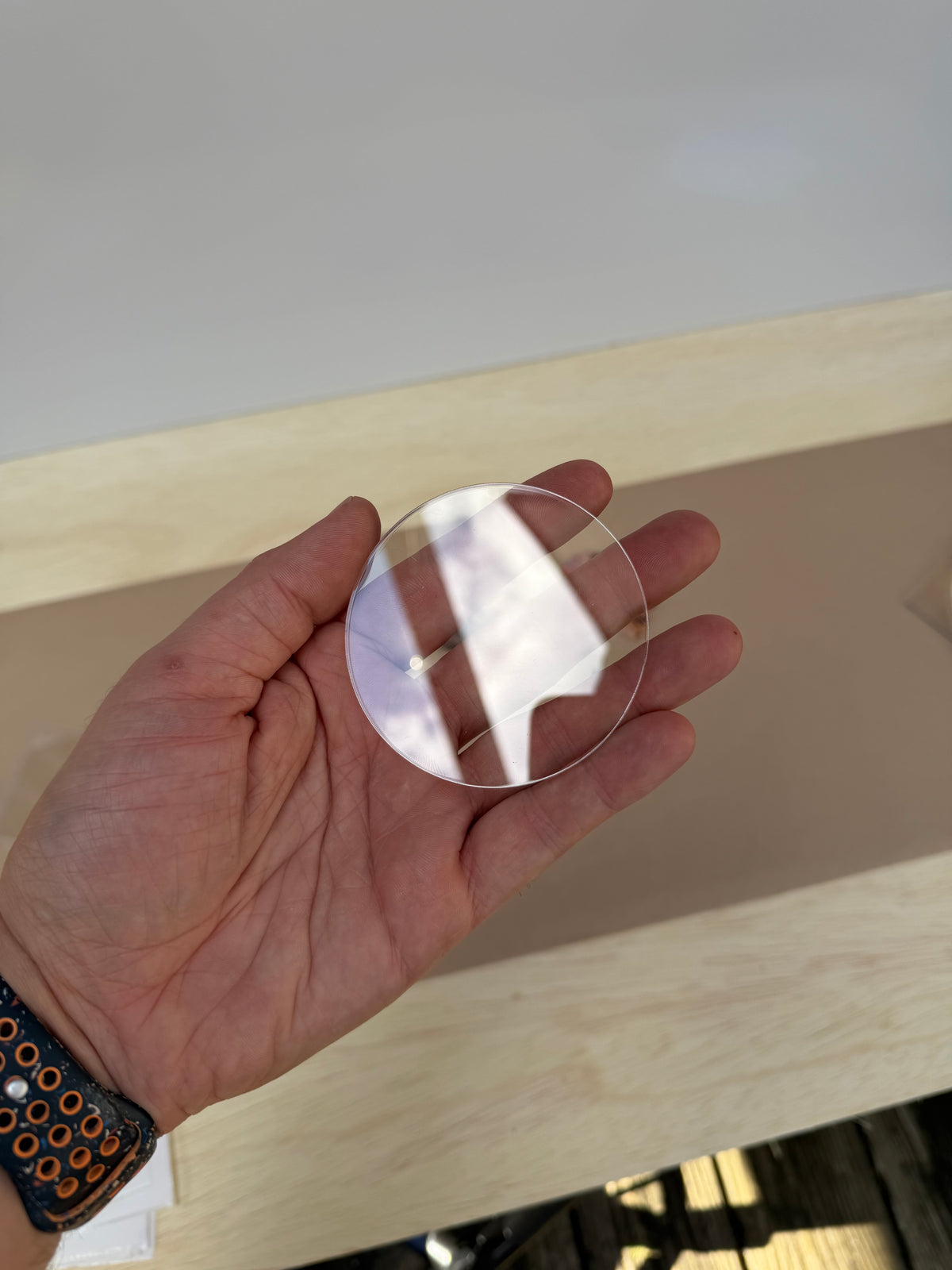 6 inch clear acrylic circle plaque blank held in hand