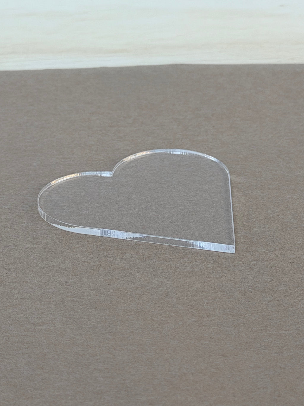 Polished laser cut edge on a 1/8 inch clear acrylic heart blank