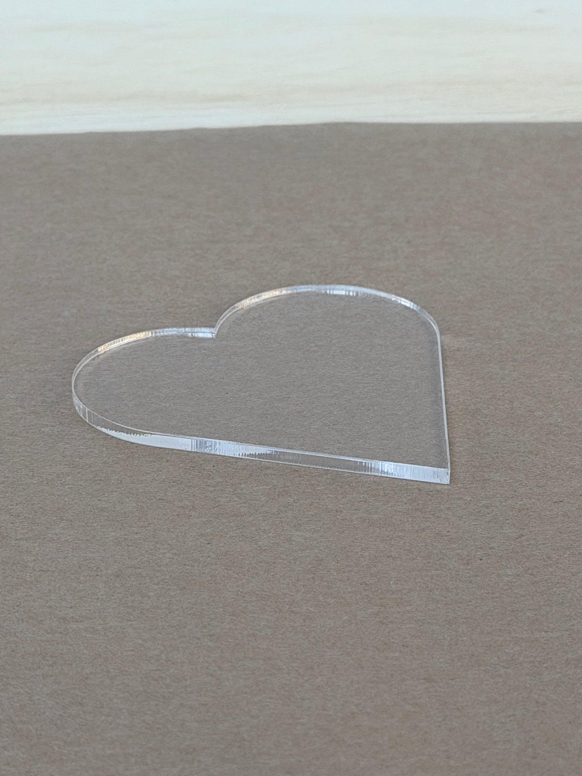 Polished laser cut edge on a 1/8 inch clear acrylic heart blank