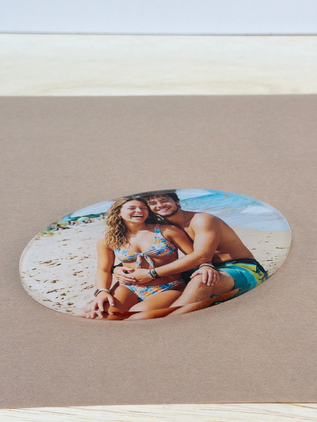 UV printed beach photo on a 1/4 inch clear acrylic oval blank