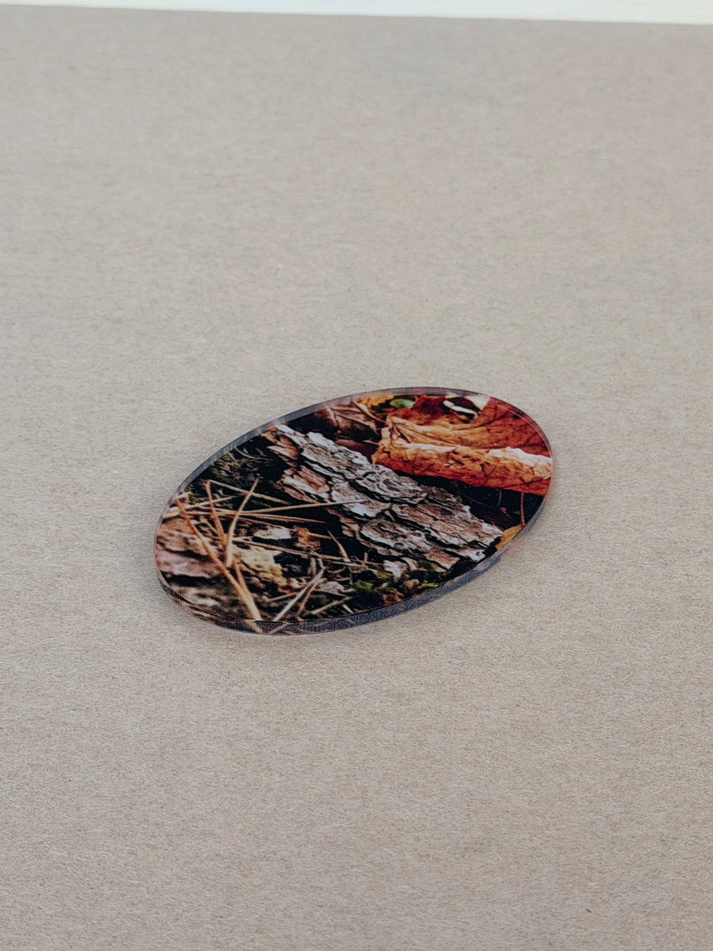 UV printed design on a 1/8 inch clear acrylic oval blank