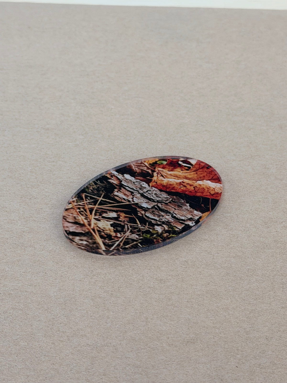 UV printed design on a 1/8 inch clear acrylic oval blank