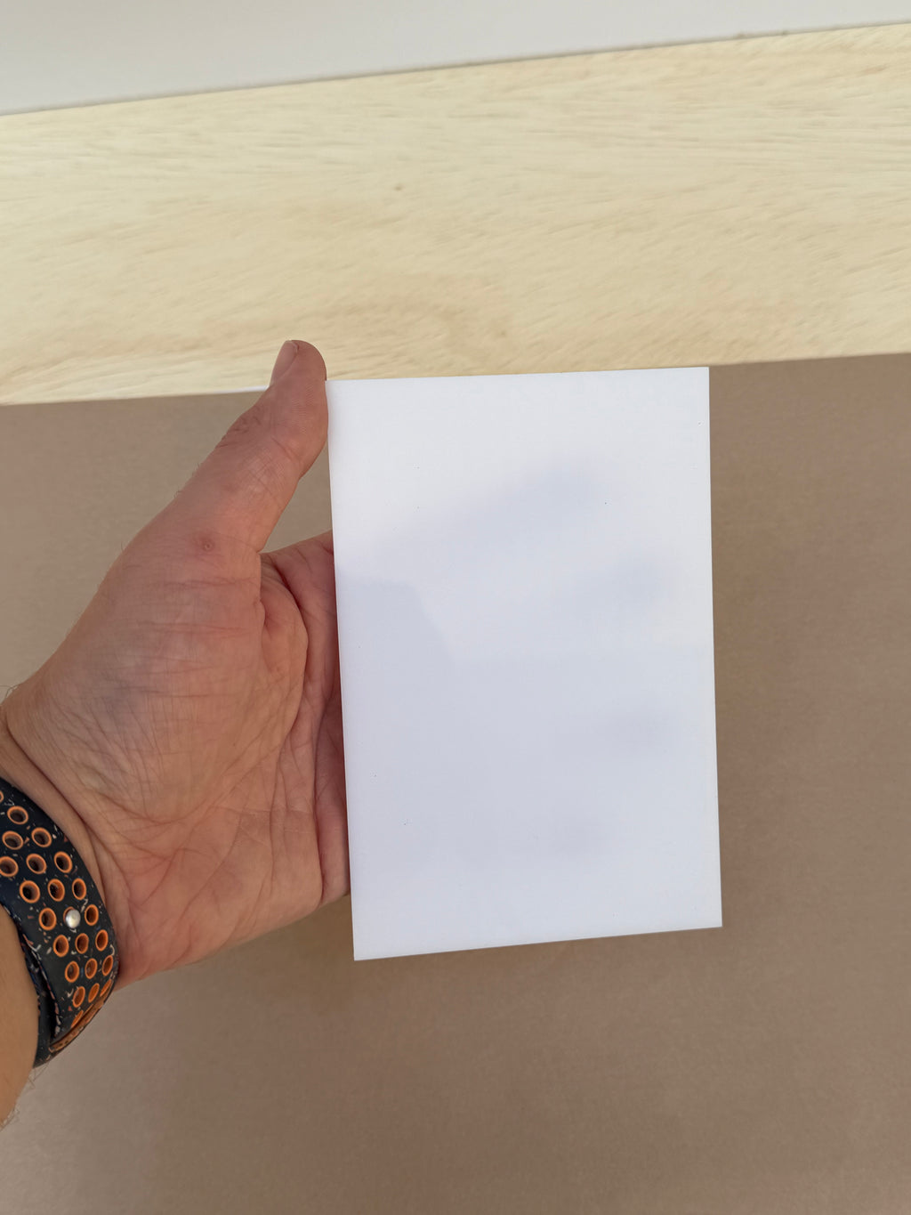 White 4x6 inch acrylic photo blank held in hand