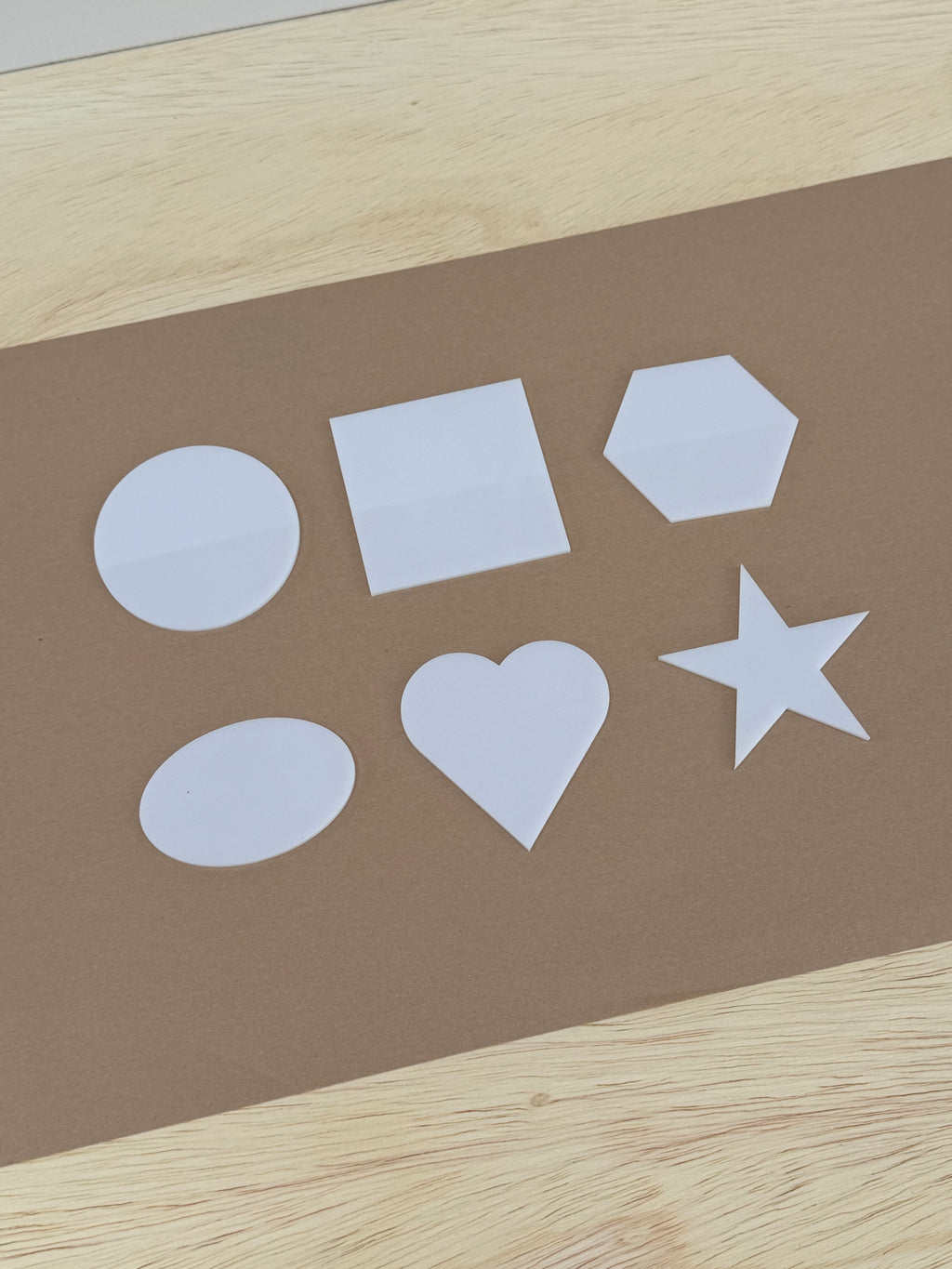 White 1/8 inch cast acrylic blanks for UV printing: circle, square, hexagon, oval, heart and star